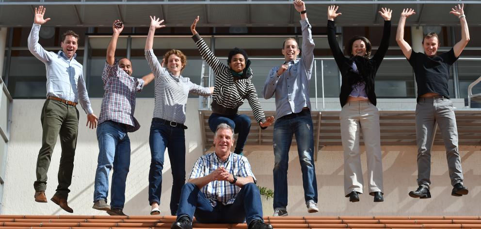 School of Physical Education, Sport and Exercise Sciences dean Prof Douglas Booth sits in front of celebrating staff members (from left) Dr Jon Shemmell, Dr Mike Sam, Dr Elaine Hargreaves, Dr Ojeya Cruz-Banks, Dr Peter Lamb, Dr Sandy Mandic and Associate 