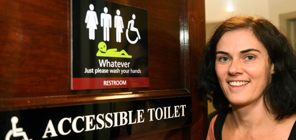 Regent Theatre marketing manager Hannah Molloy at the new all-inclusive toilet sign at the...