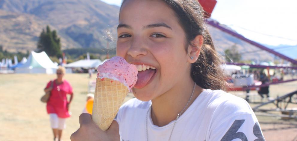 Brooke King (12), of Invercargill, cools off with an ice cream  at the Wanaka A&P Show yesterday....