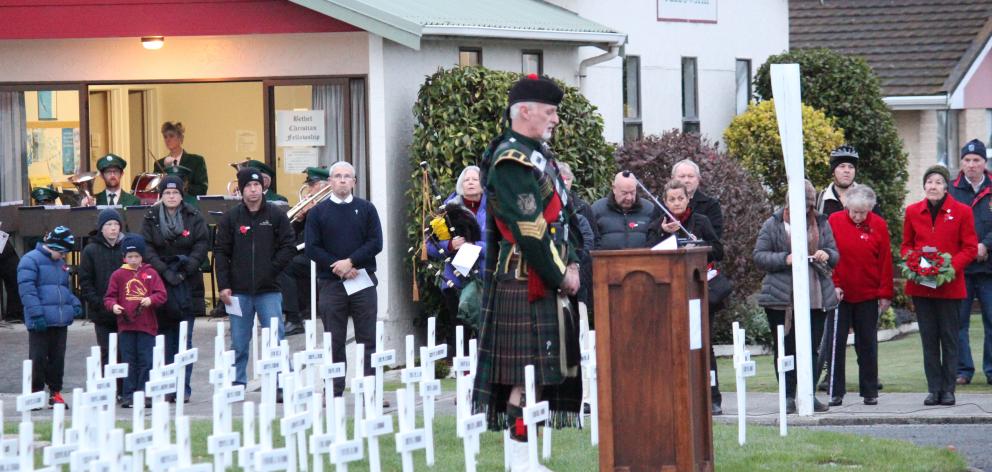 Alex McLaughlin addresses the crowd at the Balclutha Anzac Dawn Service. PHOTO: SAMUEL WHITE 
