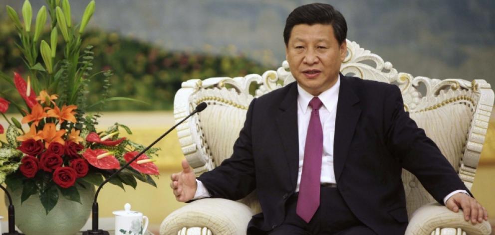 China's Vice President Xi Jinping speaks with Egypt's President Mohamed Mursi during a meeting at...