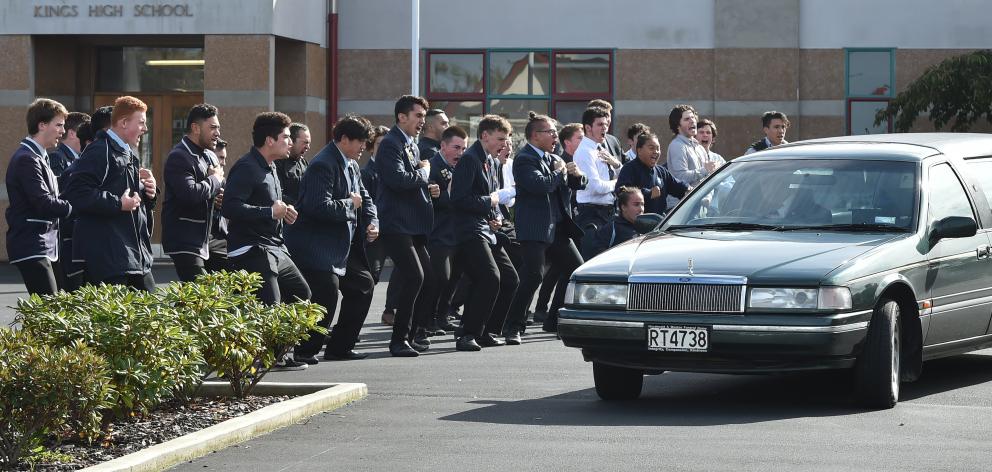 King's High School pupils perform a haka as the hearse carrying the coffin of Mitch Pereira leaves the grounds of the Dunedin school on Saturday. Photo by Gregor Richardson.