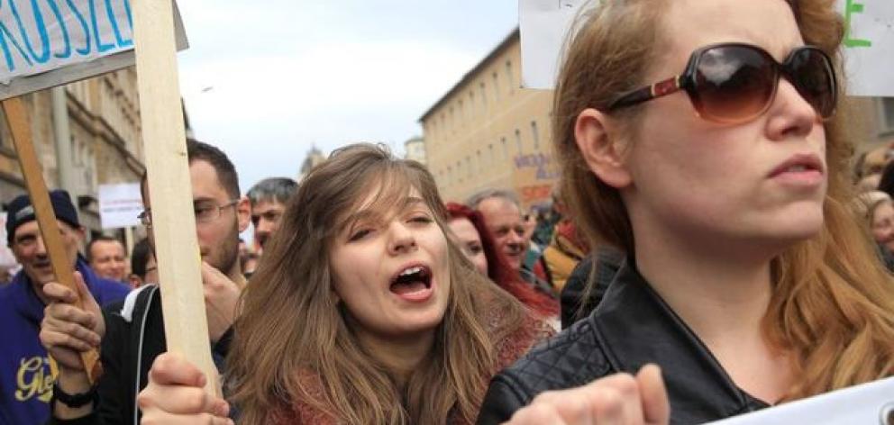 Hungarians protest against the rightwing government at a rally organised by spoof Two-tailed Dog Party in Budapest. Photo: Reuters Hungarians protest against the rightwing government at a rally organised by spoof Two-tailed Dog Party in Budapest. Photo: Reuters