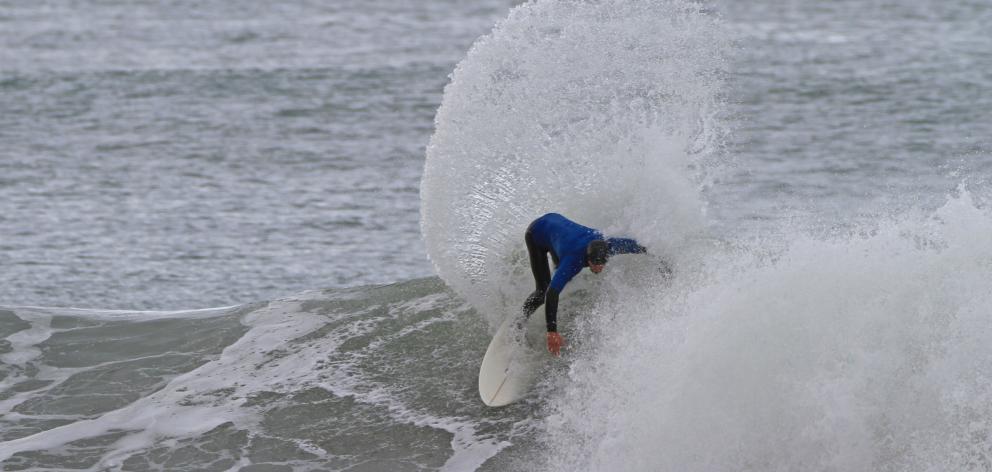 Luke Murphy rides a wave on the way to winning the South Island surfing title at Aramoana on...