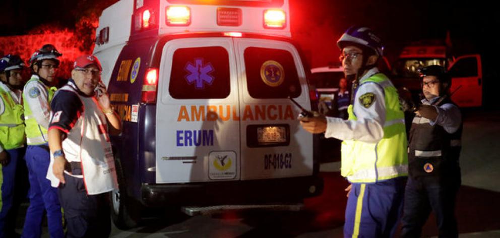 Emergency services at the scene after a structural collapse in a car park under construction in Mexico City. Photo: Reuters