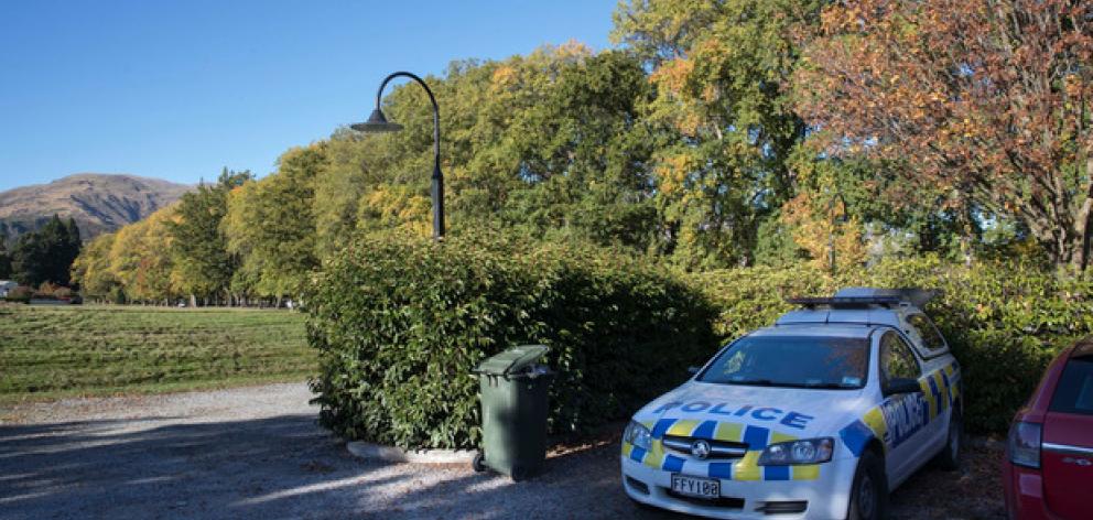 A dog handler was seen leaving a police car. Photo: NZ Herald