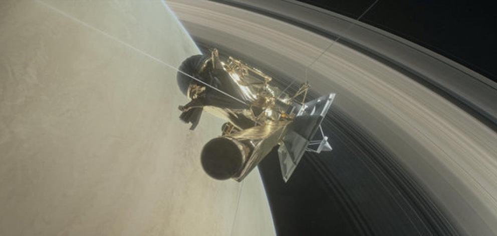 This illustration of Nasa's Cassini spacecraft about to make one of its dives between Saturn and its innermost rings. Photo: Reuters