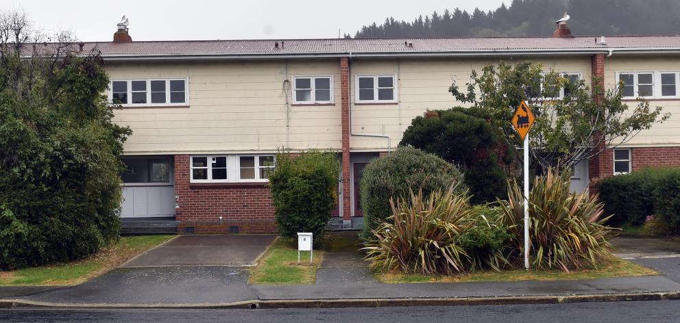 This block of three houses in Albertson Ave, Port Chalmers, is among the empty Housing New...