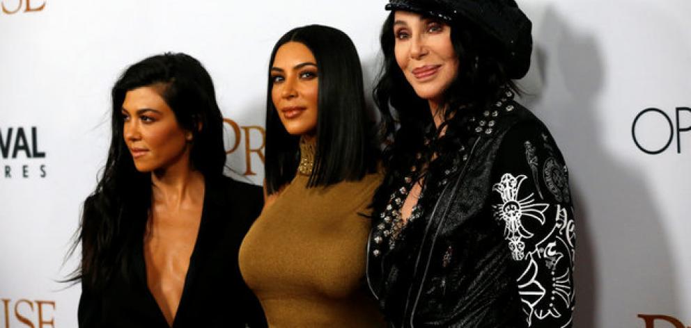 Cher poses with television personalities Kim Kardashian and Kourtney Kardashian at the premiere of "The Promise". Photo: Reuters
