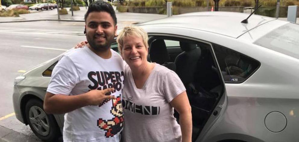 Lisa Kottke, her husband Matt, and "hero" Uber driver Harpal Kang who drove them from Auckland to Wellington over nine and a half hours for an urgent meeting after flights were cancelled due to Cyclone Debbie. Photo: NZ Herald