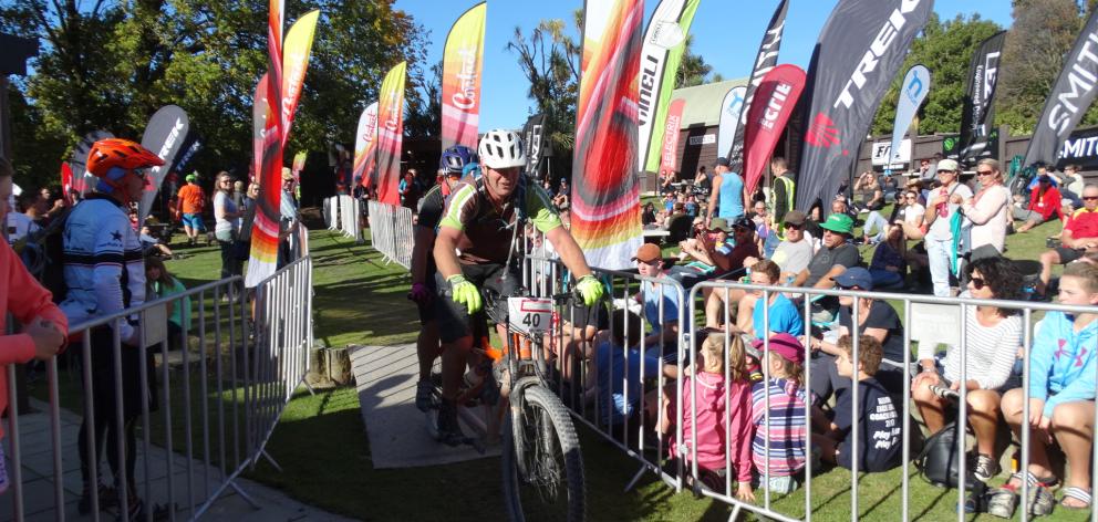 Contact Epic entrants John Fausch and wife Karen Fausch crossing the finish line after riding 95km around Lake Hawea on their tandem bike in 7hr 34min on Saturday. Photo by Kerrie Waterworth.