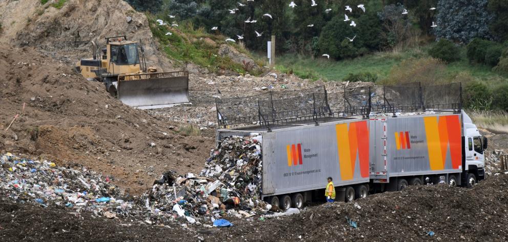 A Waste Management truck dumps a load at the company’s Fairfield landfill yesterday. Photo:...