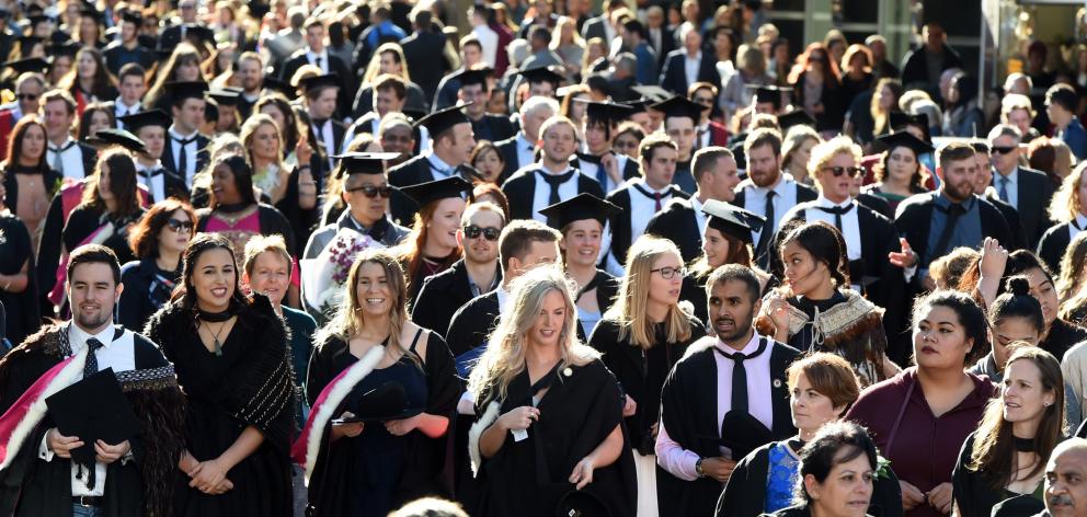 Graduands march down George St towards the Dunedin Town Hall where two University of Otago graduation ceremonies were held on Saturday. They were among about 600 graduands who received degrees and diplomas in applied science, biomedical sciences, physical