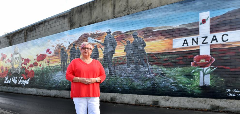 Diane Court at the new mural opposite Mosgiel RSA yesterday. Photos: Peter McIntosh.