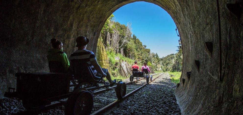 Tourists make their way along the Stratford-Okahukura Line on rail bikes. Photos: Mike Yardley.