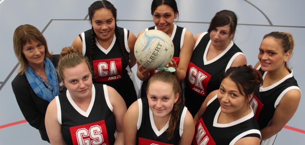 ANZ branch manager Stephanie Duffy with the Nga Whanau o Tokomairiro netball team (clockwise from back left) Te Anna Phillips, Michelle White, Jade Ackland, Keri Mack, Aroha Brich, Alice Melvin and Sammy Butter (front left). Photo: Samuel White