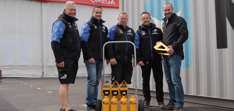 Bison chief executive Greg Fahey (right) delivers a set of Bison C-Jacks to Emirates Team New...