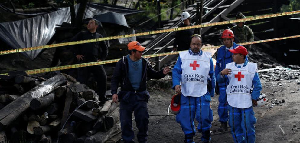 Rescue personnel coordinate to search for missing miners after an explosion at a Colombian underground coal mine. Photo: Reuters