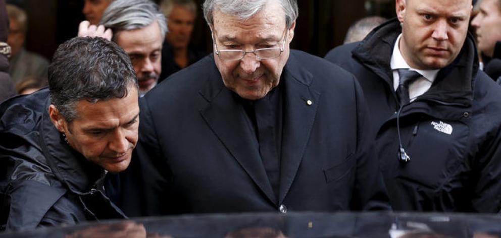 Australian Cardinal George Pell leaves at the end of a meeting with the victims of sex abuse in Rome. Photo: Reuters