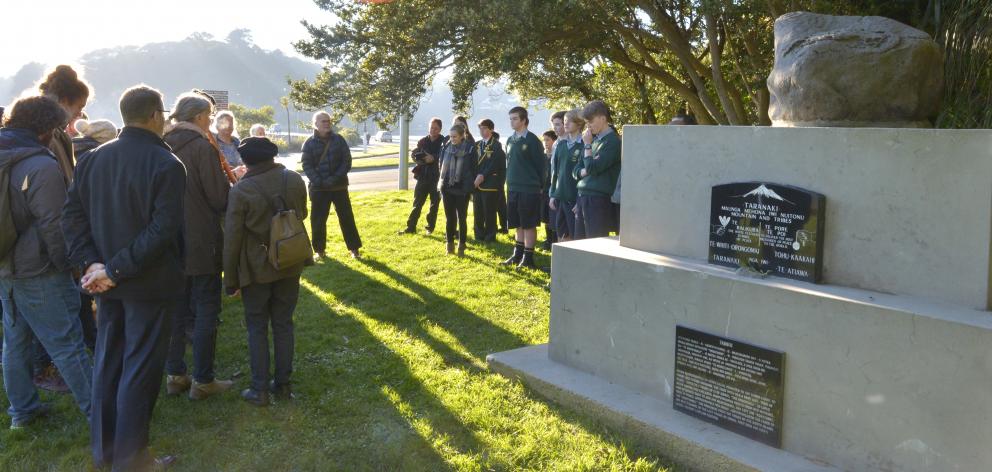 Participants gather for ‘prayers for peace’ at the Rongo Stone Memorial in Dunedin yesterday. The...