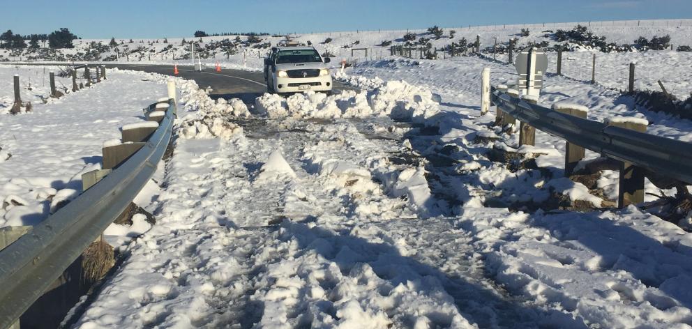Snow still covers a bridge on Kyeburn River Rd, near Ranfurly, yesterday.  Photo: Fulton Hogan.