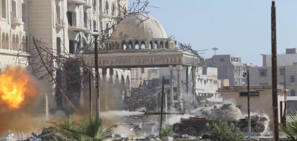 A tank belonging to special forces from the Libyan army clashes with Islamist militants in their last stronghold in Benghazi. Photo: Reuters