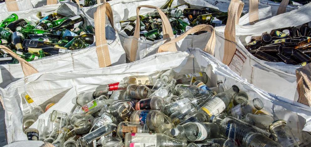 Glass sorted by colour can be recycled at the O-I factory in Auckland. Photo by Simon Williams.