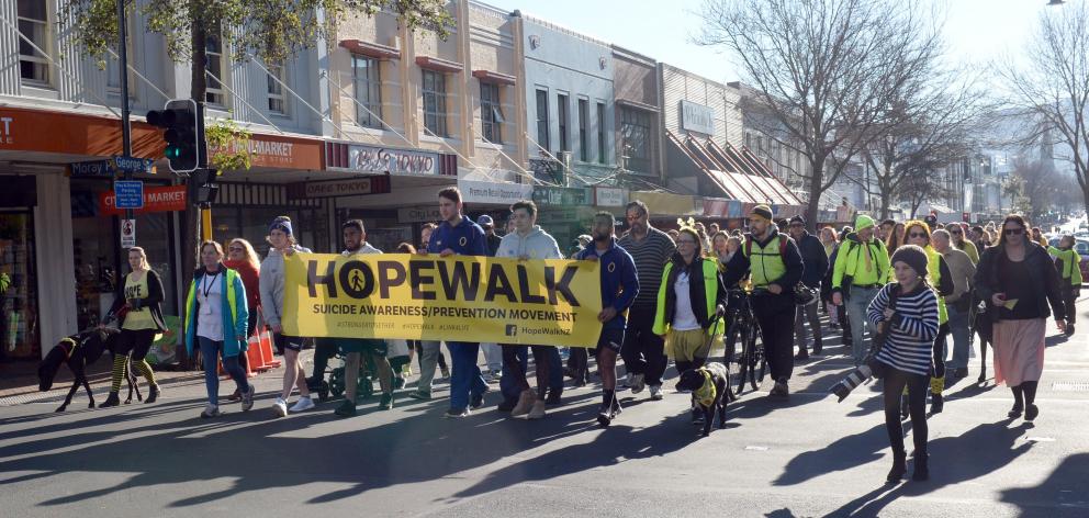 The Life Matters Suicide Prevention Trust's annual HopeWalk makes its way along George St on Saturday. Photo: Linda Robertson