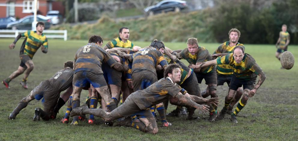 Strath Taieri halfback Stu James throws a dive pass in his team's match against Green Island on a...