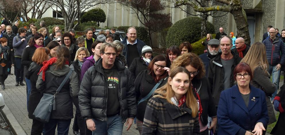 University of Otago general staff file back to work after a meeting where they were told 182 jobs...