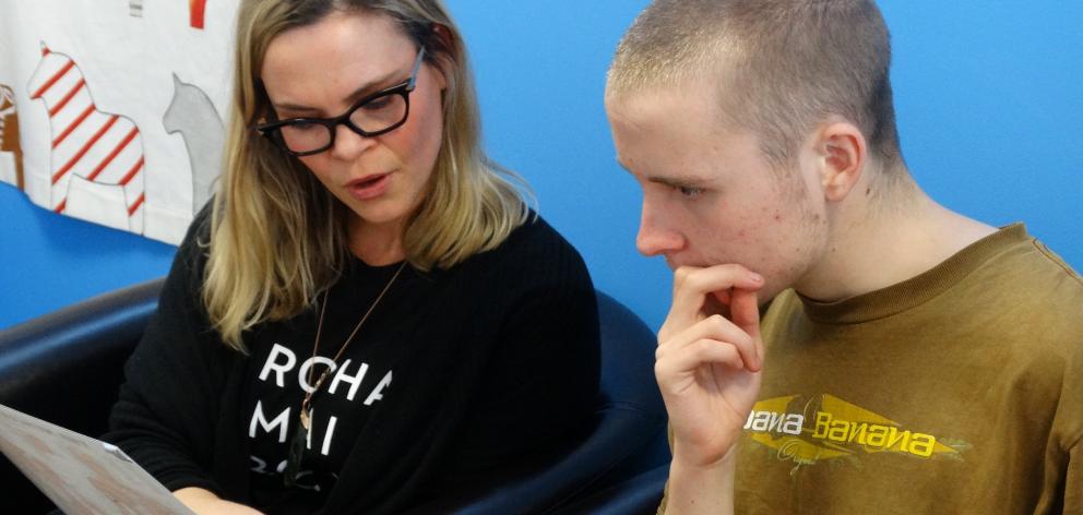 Ms Poole talks Ferdia O’Connell through his treatment in her Wanaka Osteopathic Clinic.