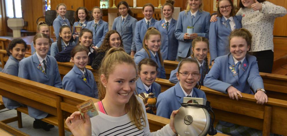 St Hilda’s Collegiate pupil Meg Kinney (front) led a group who made breakfast, including waffles,...
