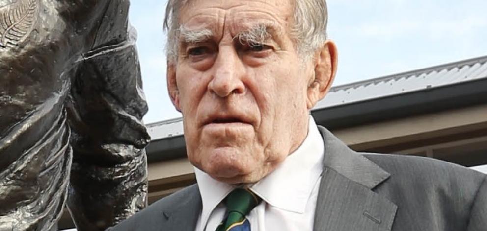Sir Colin Meads in front of the statue of himself in June in Te Kuiti. Photo: NZ Herald.