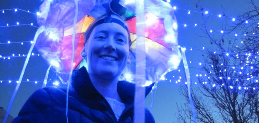 Claire Dwyer, of Cromwell, shows off her ‘‘jellyfish’’ hat at the Light Up Winter event in...