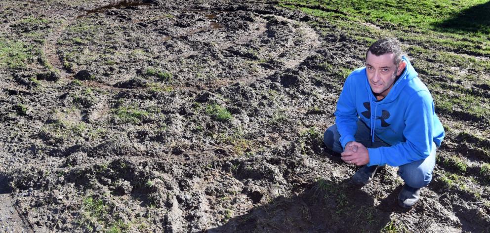 Saddle Hill Community Board chairman Scott Weatherall yesterday inspects an area of Brighton...