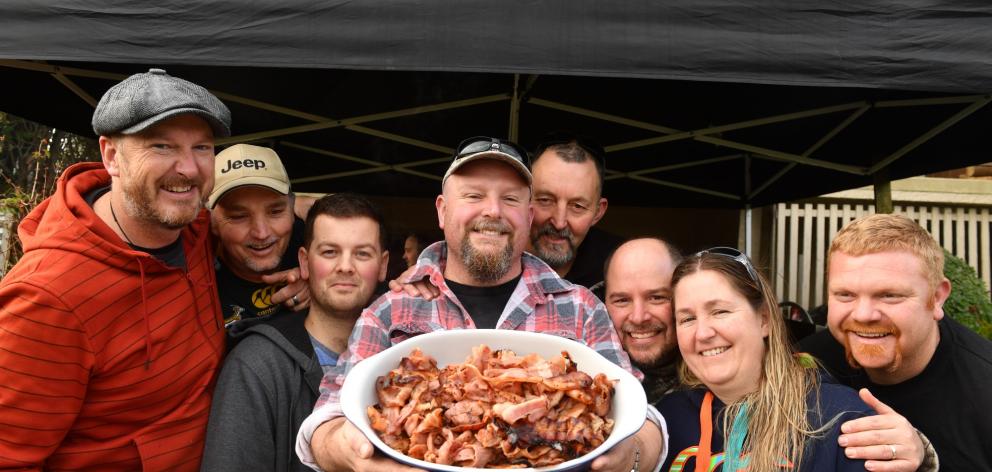 Celebrating ‘‘bacon day’’ in Dunedin yesterday were (from left) Mike Dalton, Deon Vosloo, Shawn...