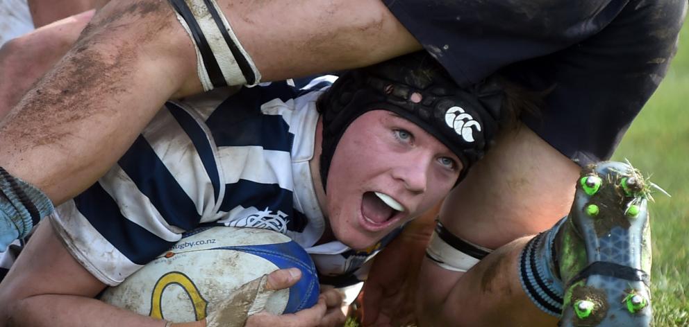 Otago Boys’ High School lock Anton Schroder looks up to celebrate after scoring a try against...