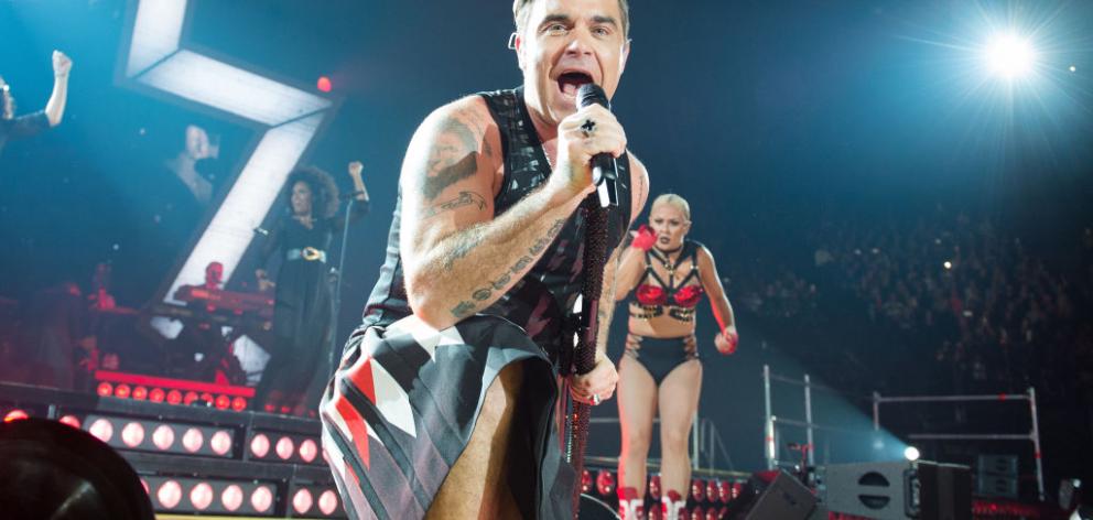 Robbie Williams performs in Paris last month. Photo Getty Images