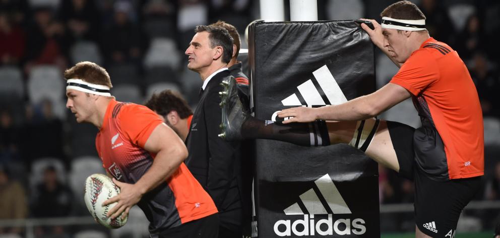 Scott McLeod stands beside the posts at Forsyth Barr Stadium last week while All Blacks Sam Cane ...