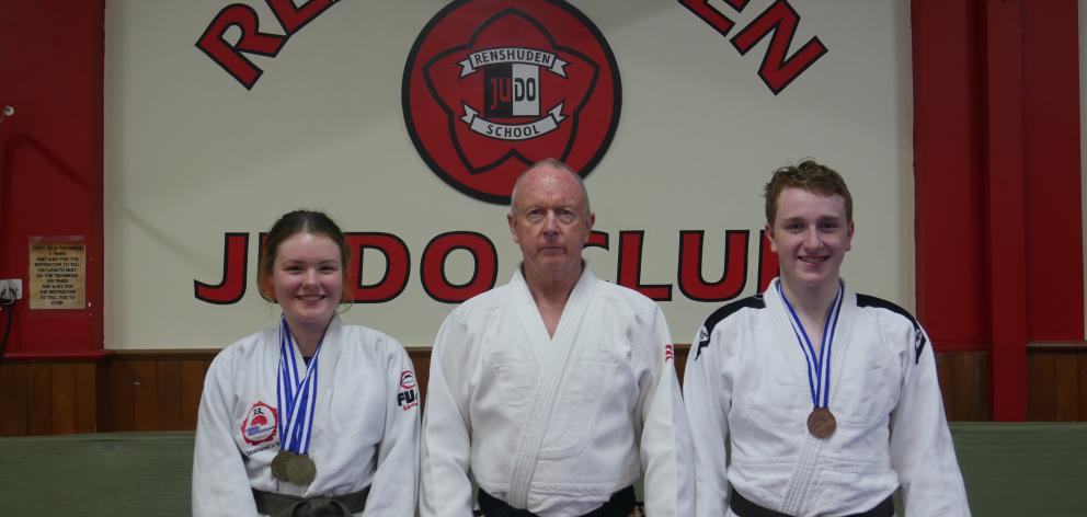 Renshuden Judo Club coach Ron Williams (centre) with members Alaina Baker (left) and Dylan Murcott (right). Alaina and Dylan recently had success at an Auckland international competition. PHOTO: JESSICA WILSON