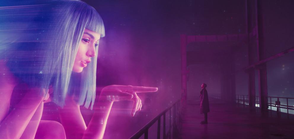 Ana de Armas as Joi and Ryan Gosling as Officer K in Blade Runner 2049. One of the difficulties...