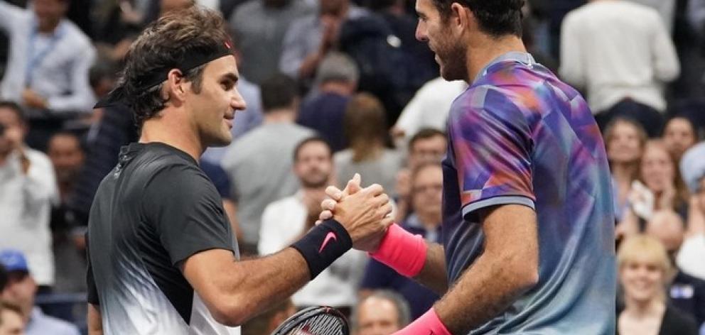 Roger Federer of Switzerland (left) greets Juan Martin del Potro of Argentina after their match on day ten of the US Open. Photo: Robert Deutsch-USA TODAY Sports