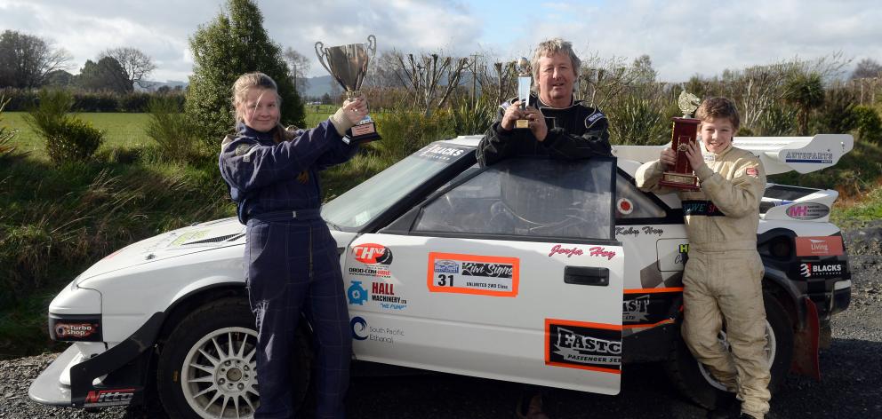 Chris Hey, flanked by his children, Jorja (13) and  Koby (12), pictured in Mosgiel yesterday with...