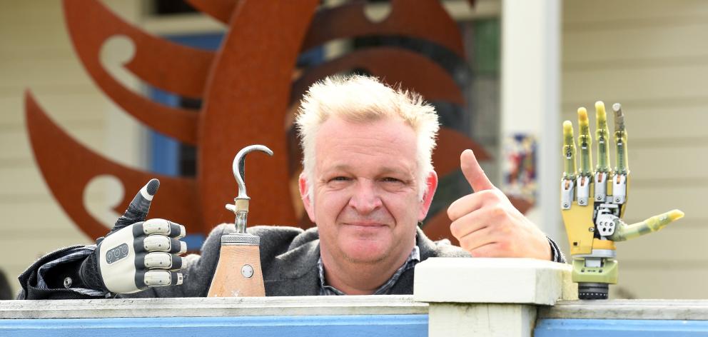Gavin Wilson of Dunedin, wears New Zealand’s newest robotic hand, which is sensitive  enough to...