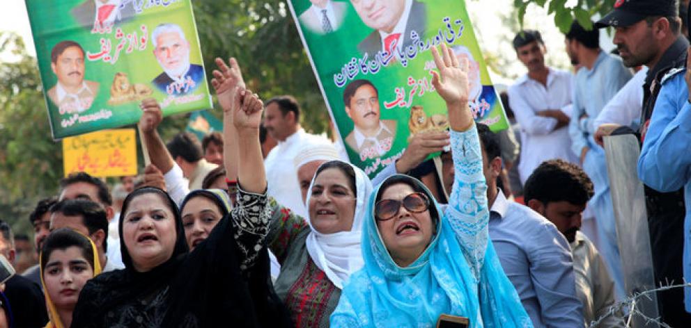 Supporters of Pakistan's former Prime Minister Nawaz Sharif chant slogans during his appearance before the accountability court in connection with the corruption references filed against him. Photo: Reuters