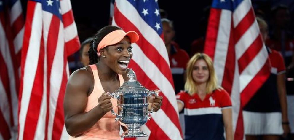 Sloane Stephens of the United States reacts with the trophy after defeating fellow American Madison Keys. Photo: Reuters