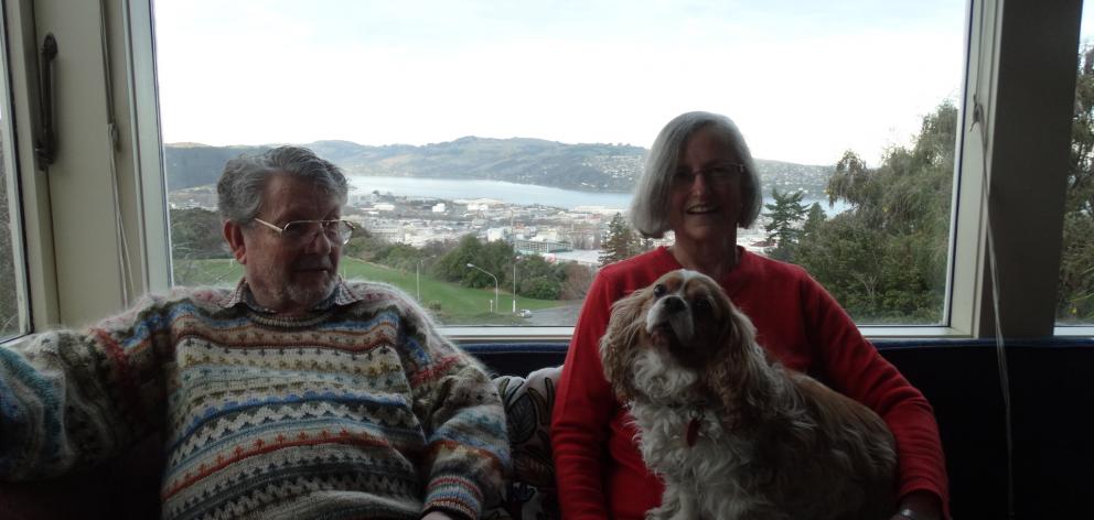 Susan and David Millar relax at home with dog Chloe, flanked by the view from the window that Mr Millar takes delight in. Finding suitable secure respite care for him is an ongoing nightmare for Mrs Millar. PHOTO: BRENDA HARWOOD