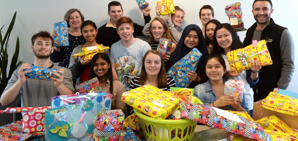 Students from the University of Otago’s Te Rangi Hiroa College display Christmas presents they...