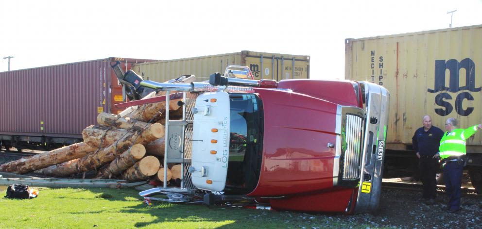 Logs spilled from a logging truck after a collision between the truck and train near Invercargill...