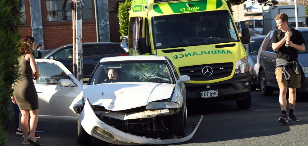 An ambulance attends a crash in Albany St, Dunedin, last night. Photo: Stephen Jaquiery